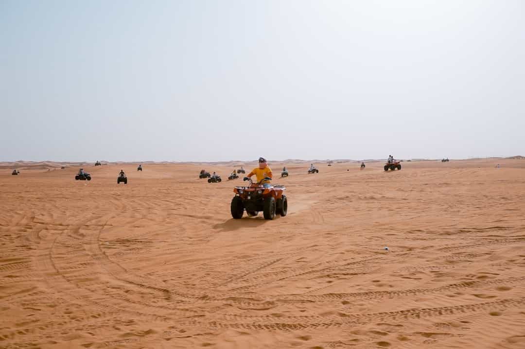 Dubai Desert Adventure: Quad Biking, Sandboarding & Campfire