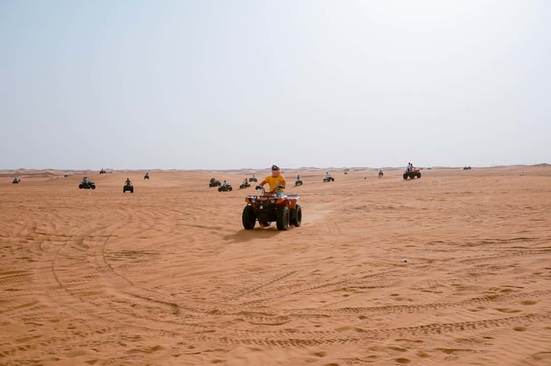 Dubai Desert Adventure: Quad Biking, Sandboarding & Campfire