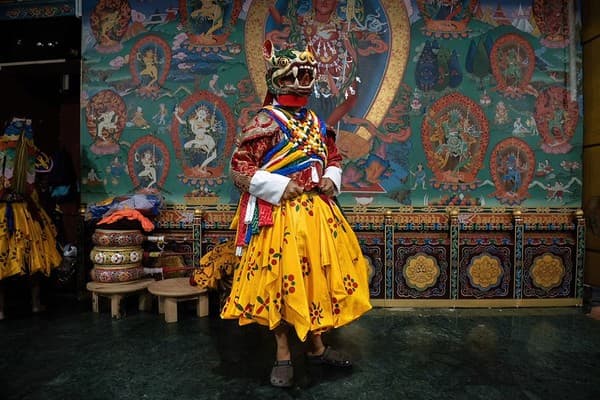 Attend a Tshechu festival (masked dances and rituals)