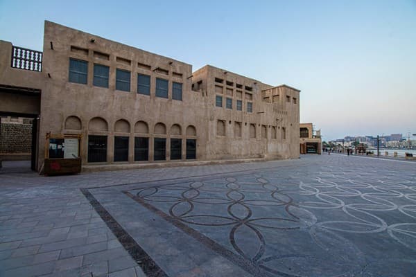 Early morning view of Al Fahidi neighborhood in Dubai, showcasing traditional architecture and quiet streets.