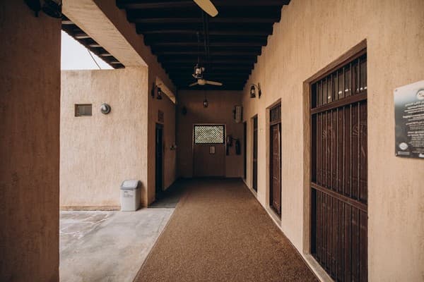 Explore the historic architecture of Al Shindagha in Dubai, showcasing traditional design and warm lighting.