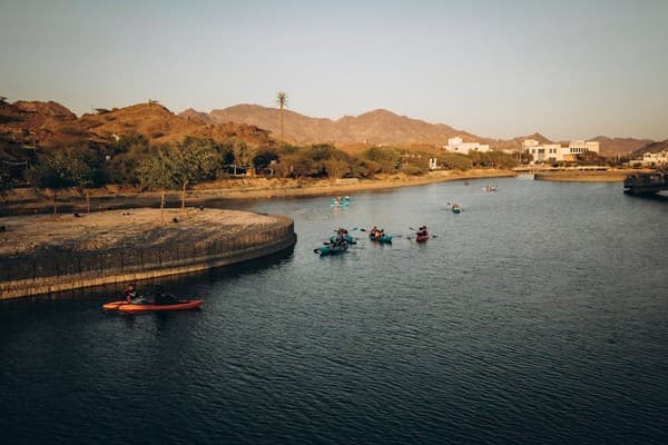 Explore the serene beauty of Hatta in Dubai with kayaks on the calm waters, set against majestic mountains. Explore the serene beauty of Hatta in Dubai with kayaks on the calm waters, set against majestic mountains.