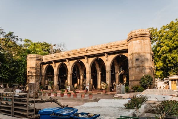Explore the iconic Sidi Saiyyed Mosque in Ahmedabad, showcasing intricate architecture and historical charm.