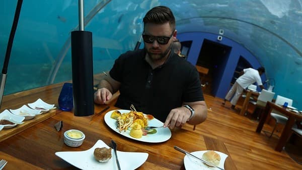 Dine at an underwater restaurant Photo 1