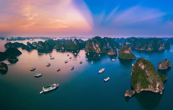 Cruise among limestone karsts in Ha Long Bay Photo 2
