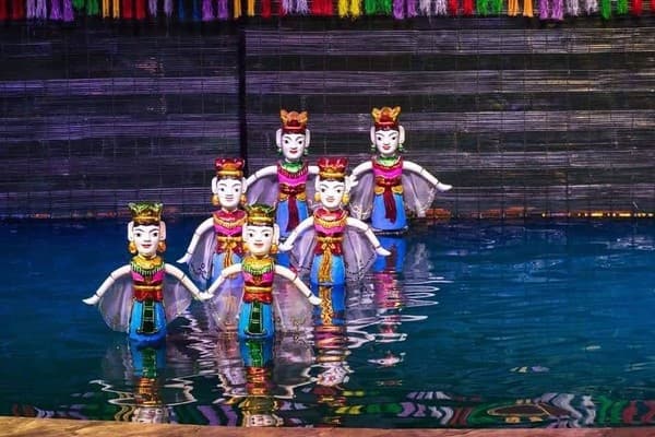 Watch a traditional water puppet show