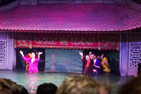 Watch a traditional water puppet show Photo 2