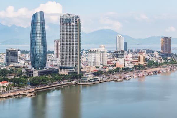 Stunning aerial view of Da Nang skyline with skyscrapers by the river. Perfect for travel and urban stock photos.
