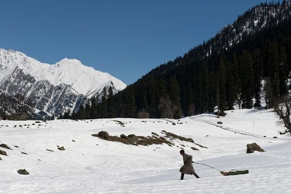 a man pulling the sledge