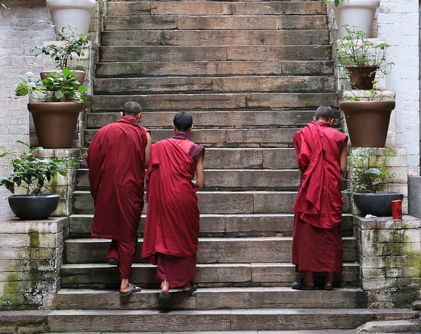 Buddhist monks leaving the prayer hall, Wangdue Phodrang, Bhutan Buddhist monks leaving the prayer hall, Wangdue Phodrang, Bhutan