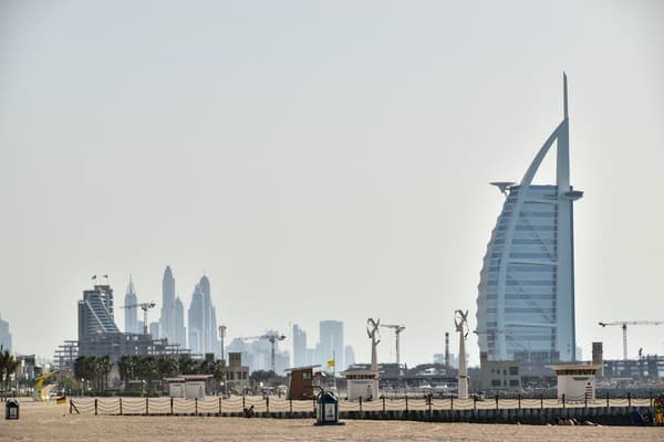 The iconic Burj Al Arab against the backdrop of Dubai's magnificent skyline, showcasing modern architecture. The iconic Burj Al Arab against the backdrop of Dubai's magnificent skyline, showcasing modern architecture.