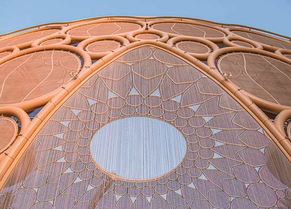 Stunning view of modern architectural design at Expo City Dubai featuring intricate facades and arches. Stunning view of modern architectural design at Expo City Dubai featuring intricate facades and arches.