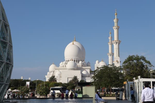 a large white building with a white dome a large white building with a white dome