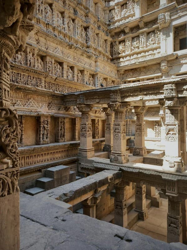 Intricately carved pillars stand timeless within Rani ki Vav, showcasing the exquisite craftsmanship of this ancient stepwell. Intricately carved pillars stand timeless within Rani ki Vav, showcasing the exquisite craftsmanship of this ancient stepwell.