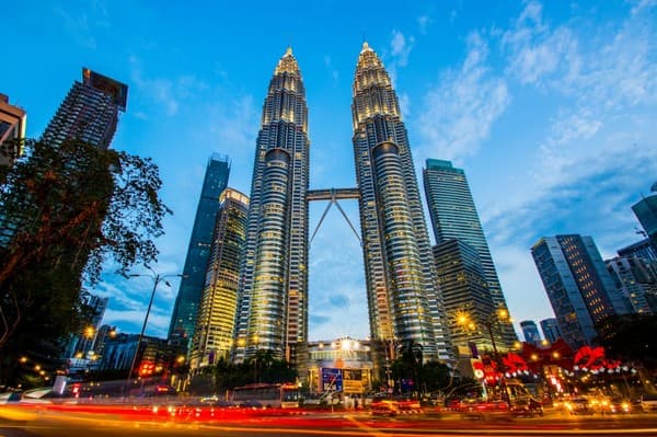Shot in the evening in front of the twin towers. Tallest building in KL, and iconic building for Kuala Lumpur, Malaysia Shot in the evening in front of the twin towers. Tallest building in KL, and iconic building for Kuala Lumpur, Malaysia