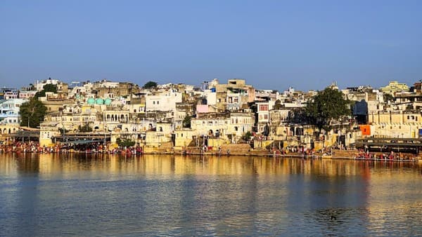 a body of water with buildings along it a body of water with buildings along it